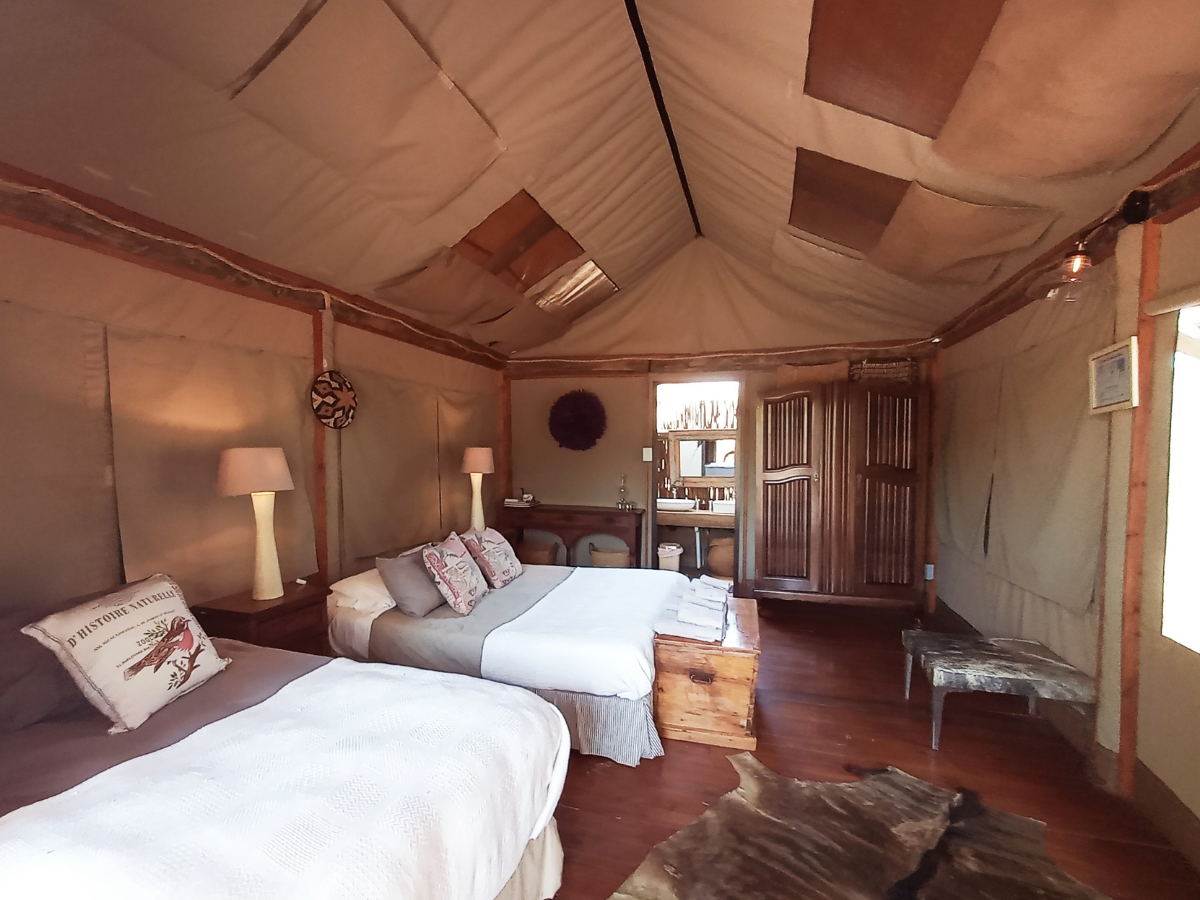 bedroom Luxury Safari Tents Luxury Safari Tent colonial-style interior with queen and single bed
