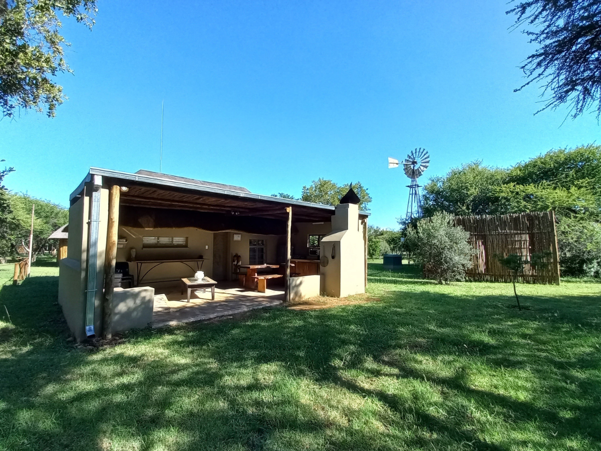 Archies Cottage Archies Cottage exterior with private outdoor kitchen and braai area at Sun Acres Farm